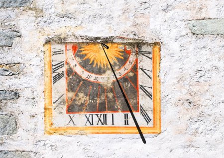 Sundial on an old wall in Salzburg, Tyrol, Austria