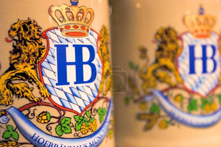 Photo for Hofbrauhaus, Munich, Bavaria, Germany, March 18th 2007, beer mugs with logo of brewery Hofbrau on lid for sale inside the souvenir shop in the Hofbrauhaus - Royalty Free Image