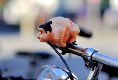 Photo for Munich, Bavaria, Germany, June 18th 2007, A bicycle horn in the shape of a sumo wrestler fixed on a handlebar - Royalty Free Image