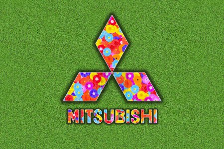 Foto de Logo Mitsubishi con flores de colores sobre fondo de trébol verde - Imagen libre de derechos