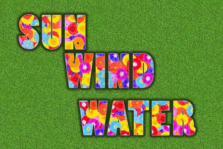 Foto de Sol, viento, agua escrita con flores de colores sobre fondo de trébol verde - Imagen libre de derechos