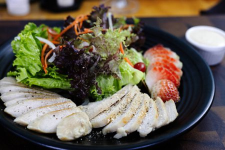Grilled Chicken Fillet And Fresh Green Leafy Vegetable Salad With Strawberry. Health Food.