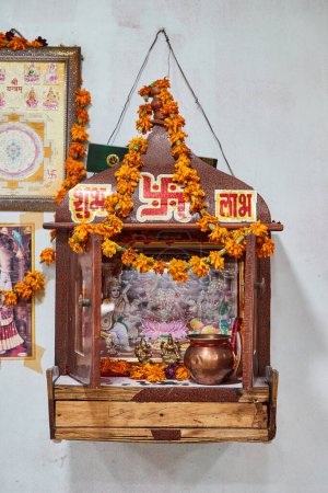 Jaipur, Rajasthan, India - small Hindu shrine on a wall in a restaurant in Jaipur