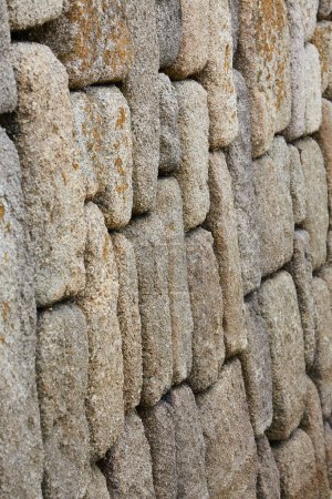 Isles of Scilly, UK - close-up of old stone wall at Hugh Town harbour