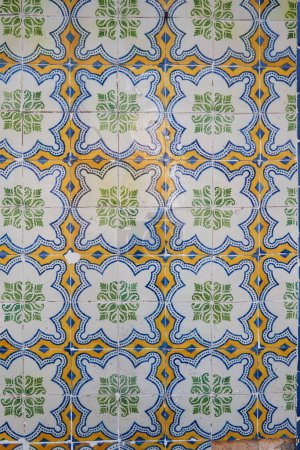 Colorful typical tiles on a wall in Portugal with traditional patterns