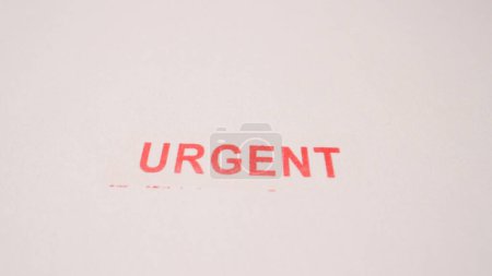 14 photo of red urgent stamp inscription on blank paper. High quality photo