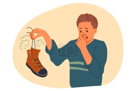 Chaussure puante dans les mains de l'homme souffrant de mauvaise odeur et de symptômes de mycose du pied. Le gars aux pieds puants a besoin de l'aide d'un dermatologue ou d'un désinfectant pour se débarrasser des bactéries puantes.