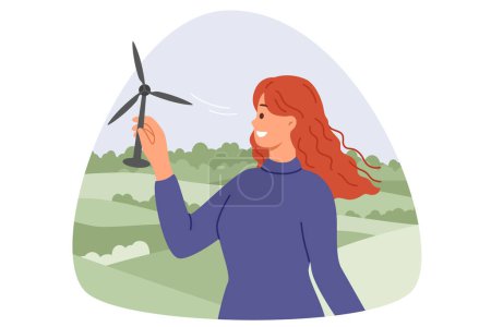 Illustration for Wind turbine in hands of woman with smile standing in nature, and developing alternative and regenerative energy. Girl installs miniature wind turbine to generate electricity from renewable sources. - Royalty Free Image