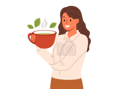 Woman drinks green loose leaf tea from large mug, enjoying bite of hot, soothing drink. Ceylon aromatic tea with mint and herbs in hand of business lady taking break while working or studying