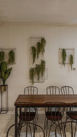 Interior of a Modern Cafe with a Wall-Mounted Plant Decoration
