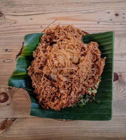 Traditional Indonesian Named Food Telur Barendo with Green Chilli on Banana Leaves