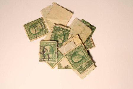 This green, vintage, one cent stamp depicts Benjamin Franklin
