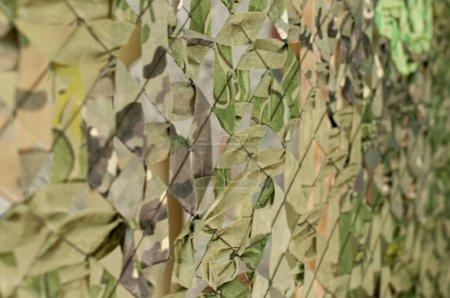 military camouflage net made by volunteers, handmade, war in Ukraine
