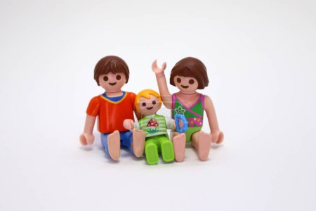 Photo for Playmobil dolls. Toys, figures. Happy kids. Isolated. Siblings. Brother, sister and little brother. Family. Family love. Small children. Childhood. Games. Family photo. - Royalty Free Image