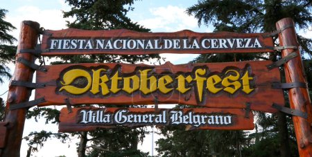 Oktoberfest. Poster of the national beer festival in Villa General Belgrano, Crdoba, Argentina. Carved wooden sign. Entrance poster. Original holiday from Germany.
