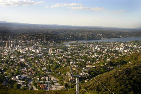 Landscape of the city of Villa Carlos Paz, Cordoba, Argentina. Tourist city of the Valley of Punilla. Latin America. Tourist attraction. View from the Aerosilla hill. Mountains, lakes. Chairlift.