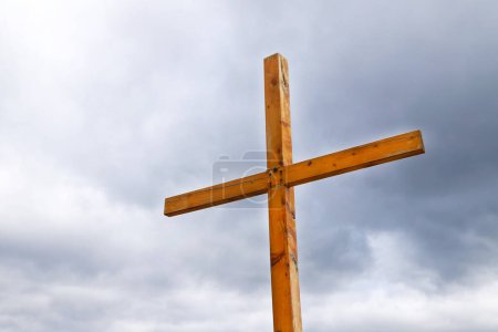 Photo for Wooden cross with the sky in the background. Religious symbol of Christianity. Catholic Cross. - Royalty Free Image