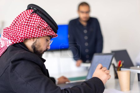 arab using laptop during work in office on meeting table to finish the project