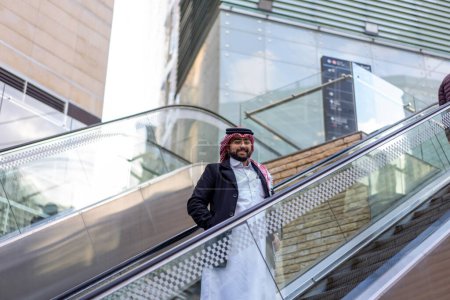 arabic man on escalator