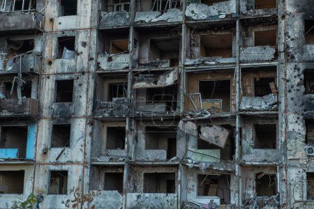 Destroyed shelled multi-storey residential building .War in Ukraine.