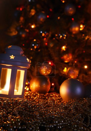 Photo for Abstract festive New Year Christmas background from shining lights of garlands, candle light and toys. - Royalty Free Image