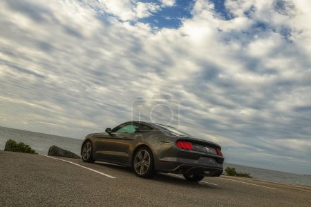 York Main , USA, September 25, 2023: Street survey of a 2015 ford mustang car by the ocean