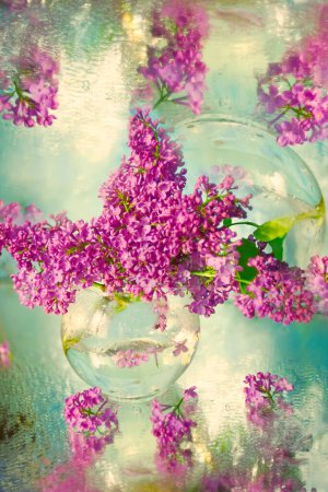 Bouquet with lilac branches on a watercolor background. delicate artistic photo with soft selective focus.