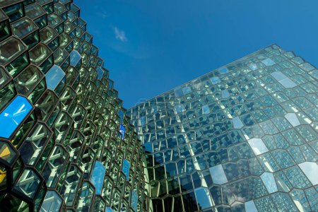 Photo for The original mirror glass facade of the building in the shape of a honeycomb against the sky. Rekjavik. Iceland - Royalty Free Image