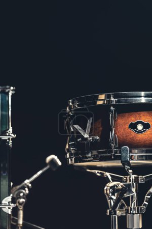 Photo for Snare drum on a blurred dark background, part of a drum kit. - Royalty Free Image