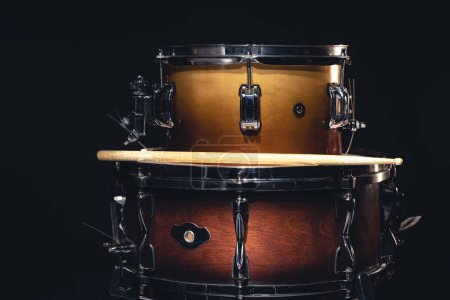 Photo for Drums on a black background isolated, percussion instrument, the concept of musical creativity. - Royalty Free Image