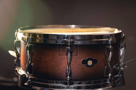Photo for Close-up of a snare drum, percussion instrument on a dark background with beautiful lighting. - Royalty Free Image