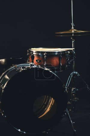 Photo for Drums on a blurred dark background, part of a drum kit, music concert cncept. - Royalty Free Image