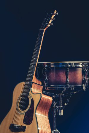 Photo for Acoustic guitar and snare drum on black background isolated, music concert concept. - Royalty Free Image