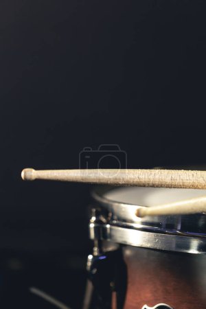 Photo for Close-up, snare drum and drumsticks on a dark background, concert concept, percussion instrument close-up. - Royalty Free Image