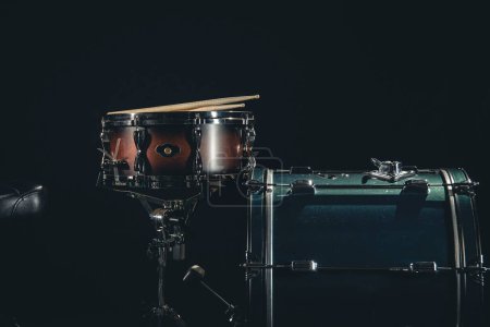 Photo for Drum set on a black background close-up, musical background. - Royalty Free Image