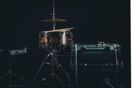 Photo for Drum set on a black background close-up, musical background. - Royalty Free Image