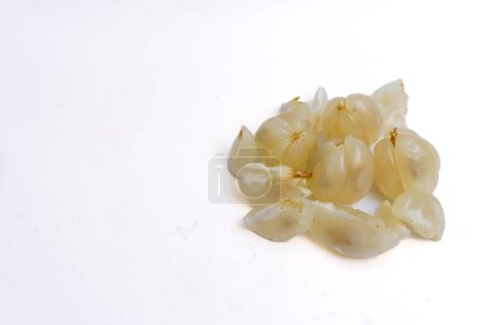 Close up view the flesh of duku fruit or Lansium parasiticum.This tropical fruits comes from western Southeast Asia isolated on white background.