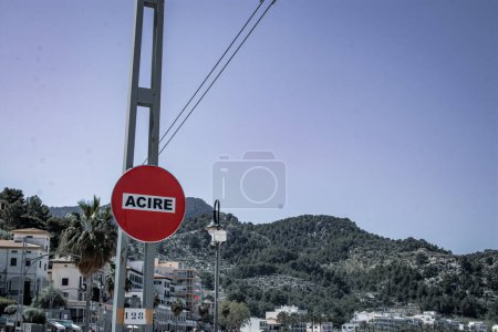 A red sign prominently displaying "ACIRE," indicating Restricted