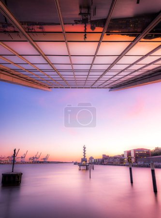 View from the basement of Dockland Hamburg across the Elbe at sundown. High quality photo