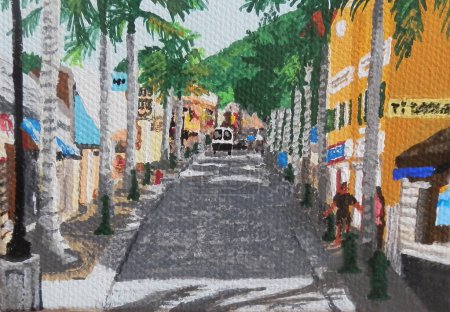 One-way, single lane Front Street, the main street of Philipsburg, St. Maarten, is lined with stores and restaurants and shaded by palm trees.        
