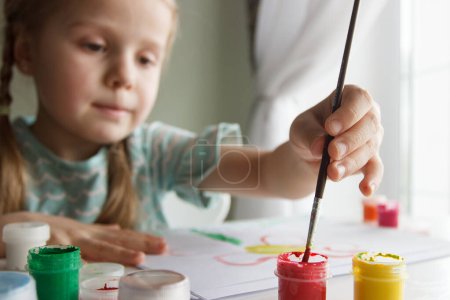 Foto de Little child draws with watercolor, concept of education in the kindergarten, soft focus background - Imagen libre de derechos