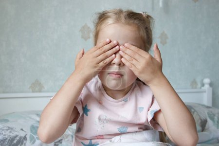 Photo for Little cute child closing ears with hands. The fear of loud sounds ?oncept or depression - Royalty Free Image