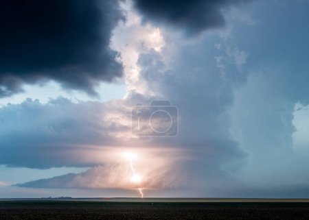 Big Storm Cloud Lit Up By Bright Lightning Bolt