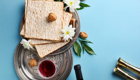 Photo for Passover holiday background with matzoh bread, wine and peony flowers. top view - Royalty Free Image