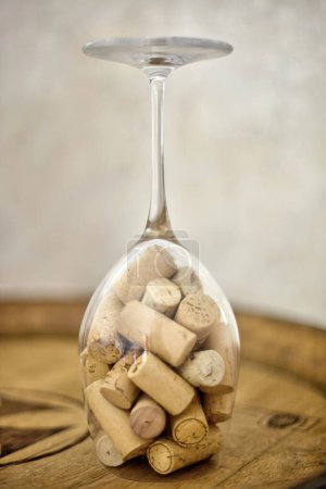 Wine glass filled with wine corks, a testament to cherished memories and celebrated moments.