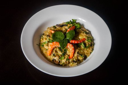 Delicious shrimp risotto, a savory Italian dish made with Arborio rice, seafood broth, and flavorful herbs, garnished with plump shrimp.