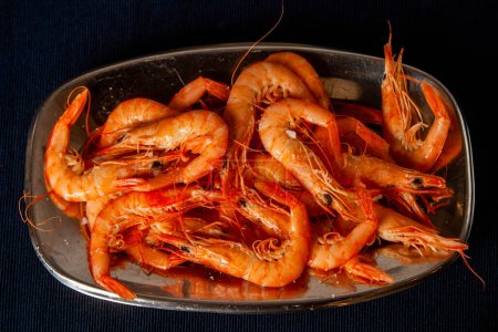 Delicious cooked shrimp served on a platter, perfect for seafood enthusiasts. Vibrant colors and enticing presentation.