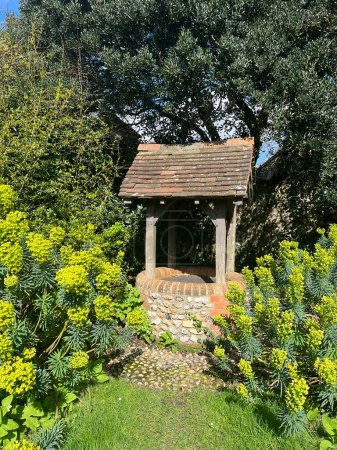 Vintage stone brick well next to Rudyard Kipling's garden