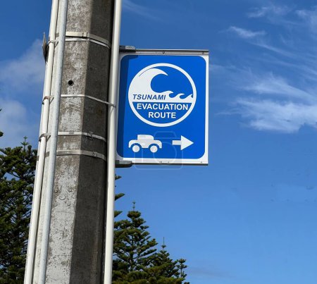 Tsunami Hazard Zone warning sign on the Pacific Ocean coast warn the public about possible danger after an earthquake..