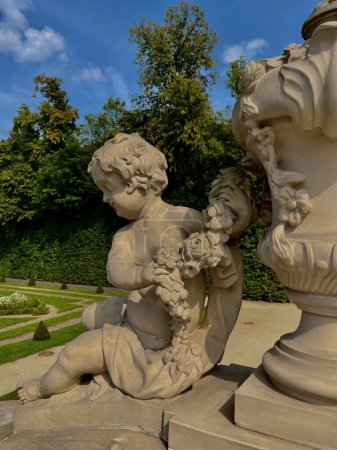 The royal Wilanow Palace in Warsaw, Poland. View on the main facade, water station, sculptures and neighborhood of the palace. High quality photo